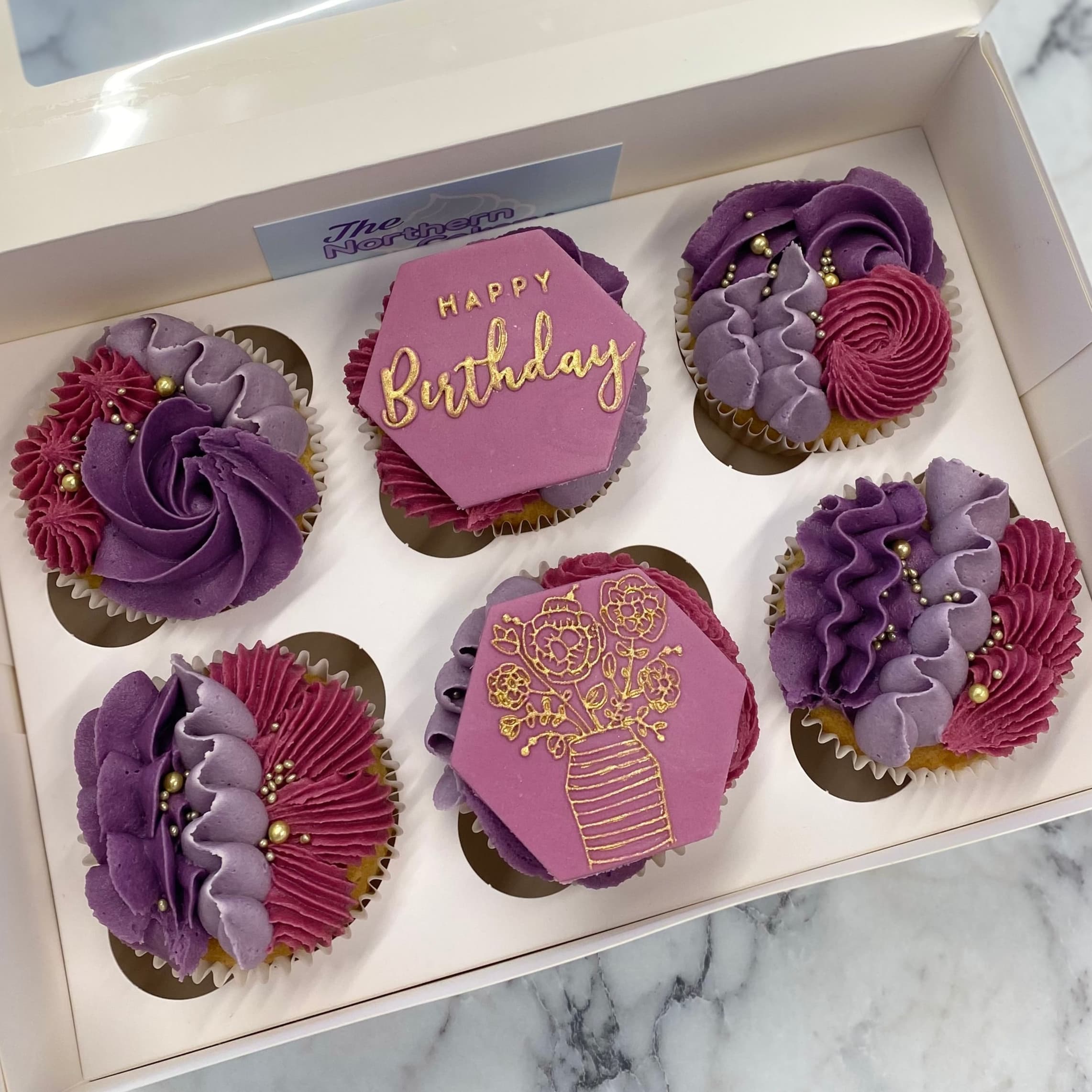 Birthday cupcakes with decorated toppers